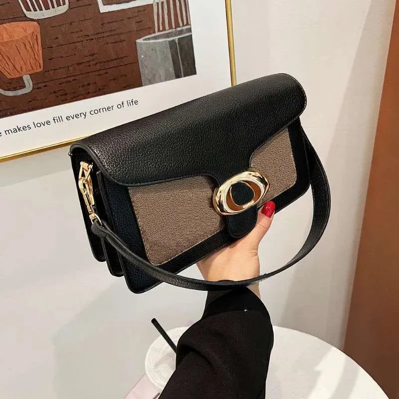 Tabby chain clutch in colorblock signature canvas hotsell