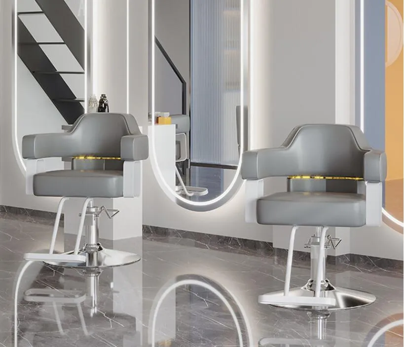 De stoel van de kapper in de winkel van de kapper kan worden opgetild en verlaagd. Salon Furniture, Salon Barber Chair.