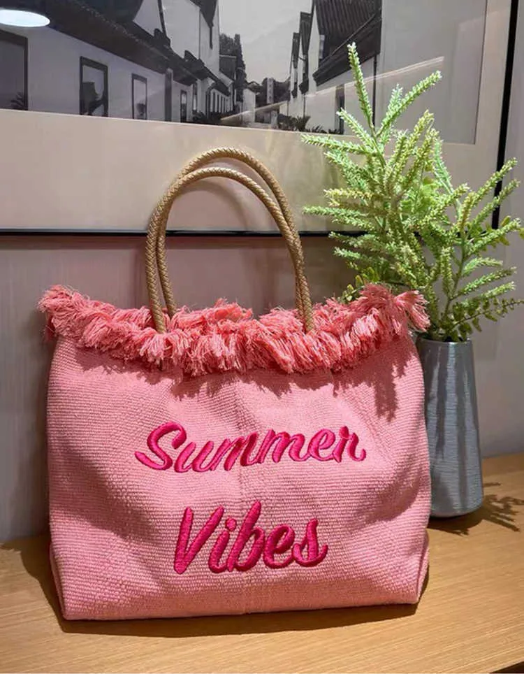 TOTES WOMINER PINK CANVAS CANVAS TASSELS حقائب الكتف الحياكة قطعة قماش مطرزة على حقائب يد الإناث صيف السفر الشاطئ حقيبة Y2302