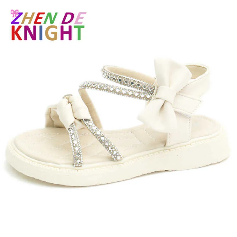 Sandaler Girls Princess Sandals 2022 Summer Roman Shoes Soft Sole Girls Beach Shoes Fashion Bow paljetter Flat Barn Sandaler Storlek 2337 Z0225