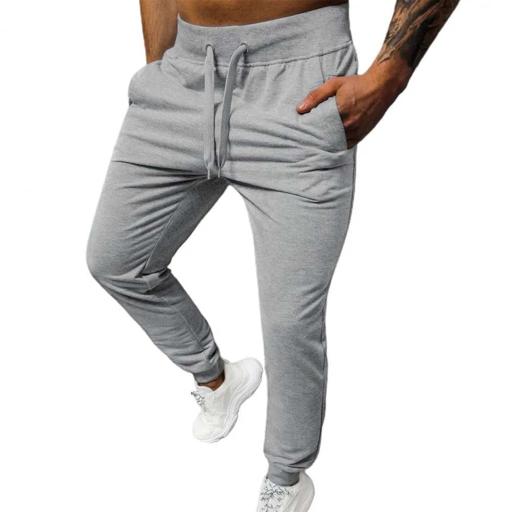 2023 Simple couleur unie cheville bandé hommes pantalons chaud taille élastique poches surdimensionnées pantalons de survêtement Streetwear pour