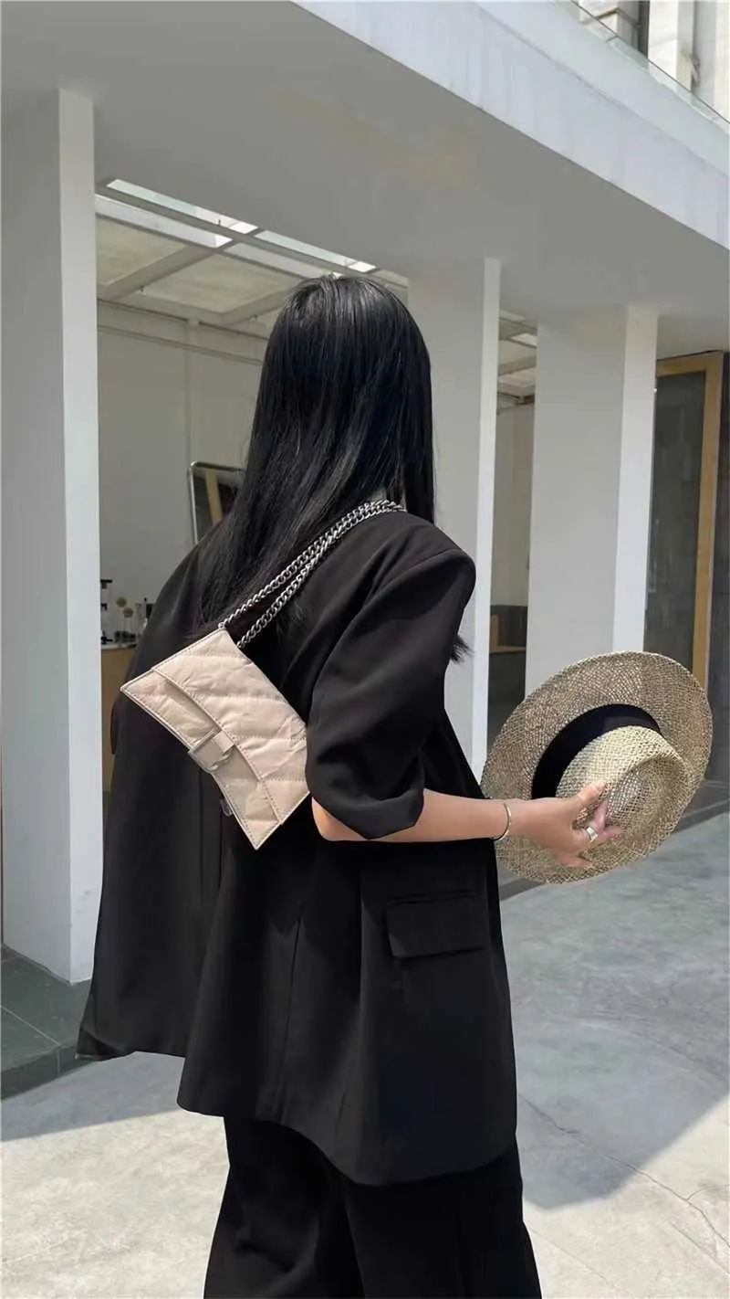 Top layer cowhide women's bag 2023 new origami feel hand grip pattern chain mini hourglass bag single shoulder crossbody bag