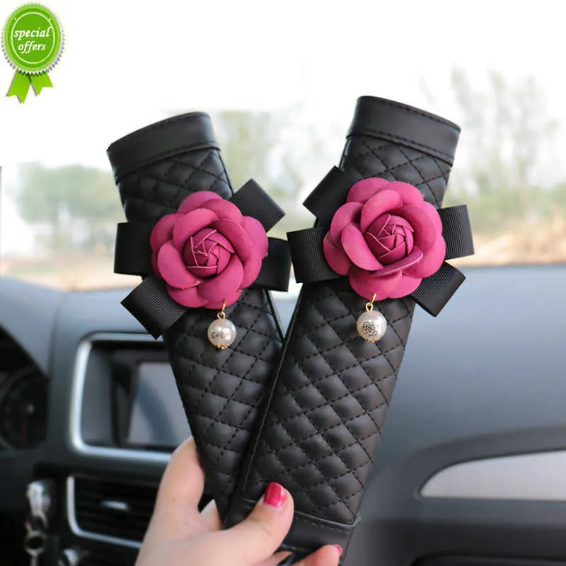 Nouveau 2 pièces fleur de camélia voiture ceinture de sécurité couverture en cuir PU épaulette voiture style ceinture de sécurité couverture voiture accessoires pour femmes