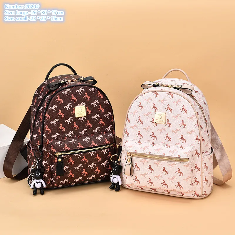 Factory wholesale ladies shoulder bag 2 colors street cartoon pendant travel backpack outdoor wear-resistant leather leisure backpacks cute printed handbag