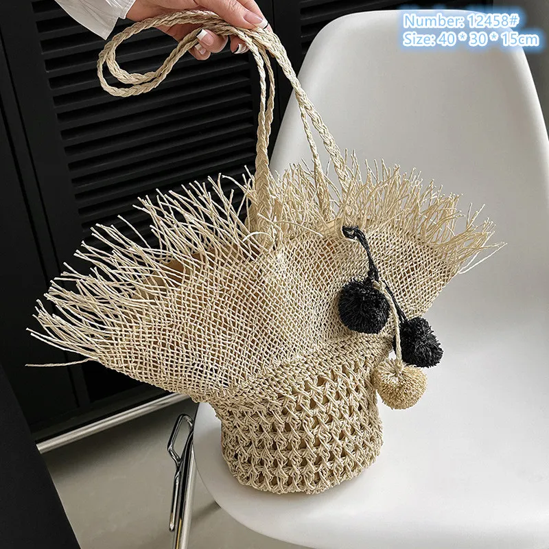 Factory wholesale ladies shoulder bags 2 colors summer travel holiday straw beach bag hat fashion handbag personalized hair ball pendant woven handbags