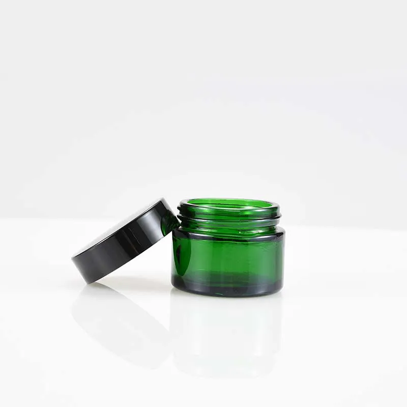 Luxuskosmetik-Körpercremeglas aus grünem Glas, Verpackung 20 ml, 30 ml, 50 ml, mit schwarzem Schraubdeckel
