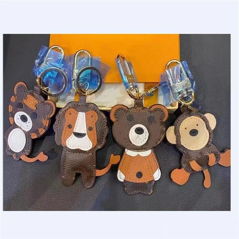 Keychains Lanyards Lion Tiger Monkey Bear Luxury Designer Leather Key Chain Laser Embossed Bag Pendants With Box 1853231E Drop Del231r