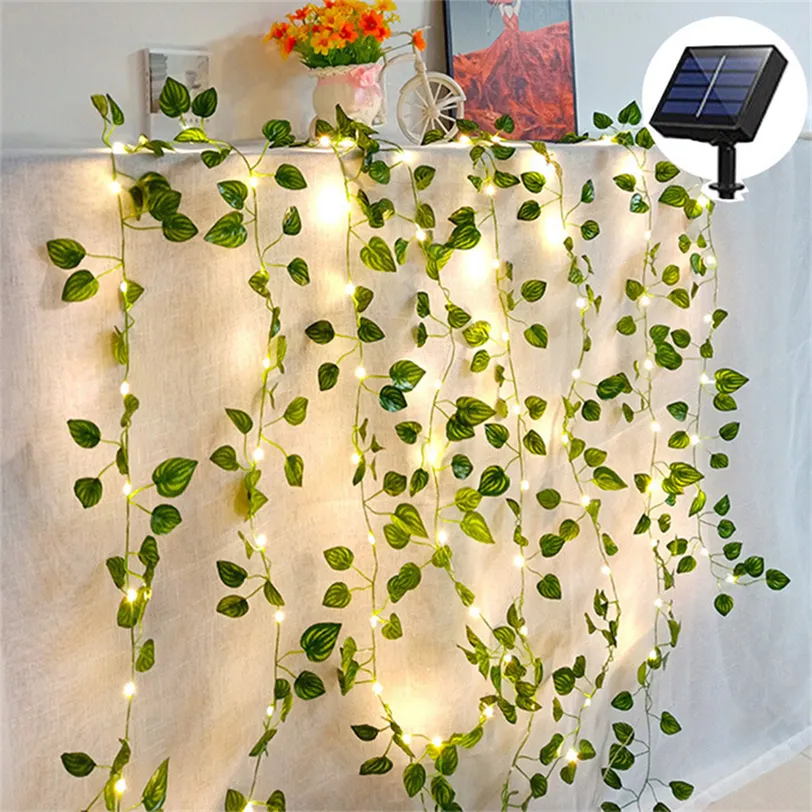 Solar Ivy Fairy Lights, 33ft 100 LED Solar Vine String Lights, 8 lägen Gröna konstgjorda bladväxter Vine Garland med ljus, fest bröllop trädgård rum väggdekor