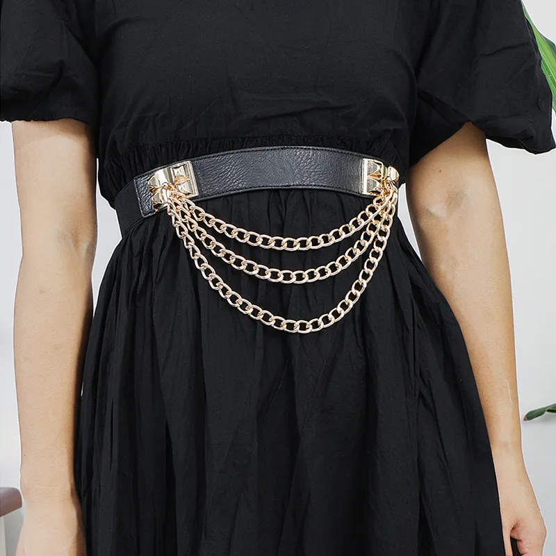 Black dress with a gold chain belt  Black dress accessories, Black dress,  Black dress style