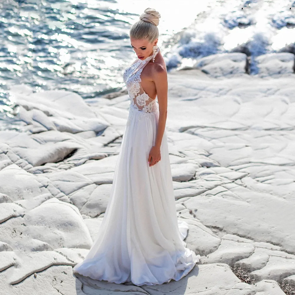 Boho Halter Chiffon Beach Wedding High neck Wedding dress with High Split, Appliques, Lace, and Backless - Floor Length Bridal Party Gown (2023) Boho Halter Chiffon Beach Wedding High neck Wedding dress with High Split, Appliques, Lace, and Backless - Floor Length Bridal Party Gown (2023)