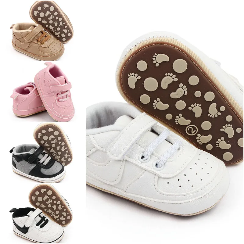 Ny stil babyskor nyfödda första vandrare baby flickor pojkar mjuk sula sko anti slip pu läder sneakers hårt ensamför förbipasserande 0-18m