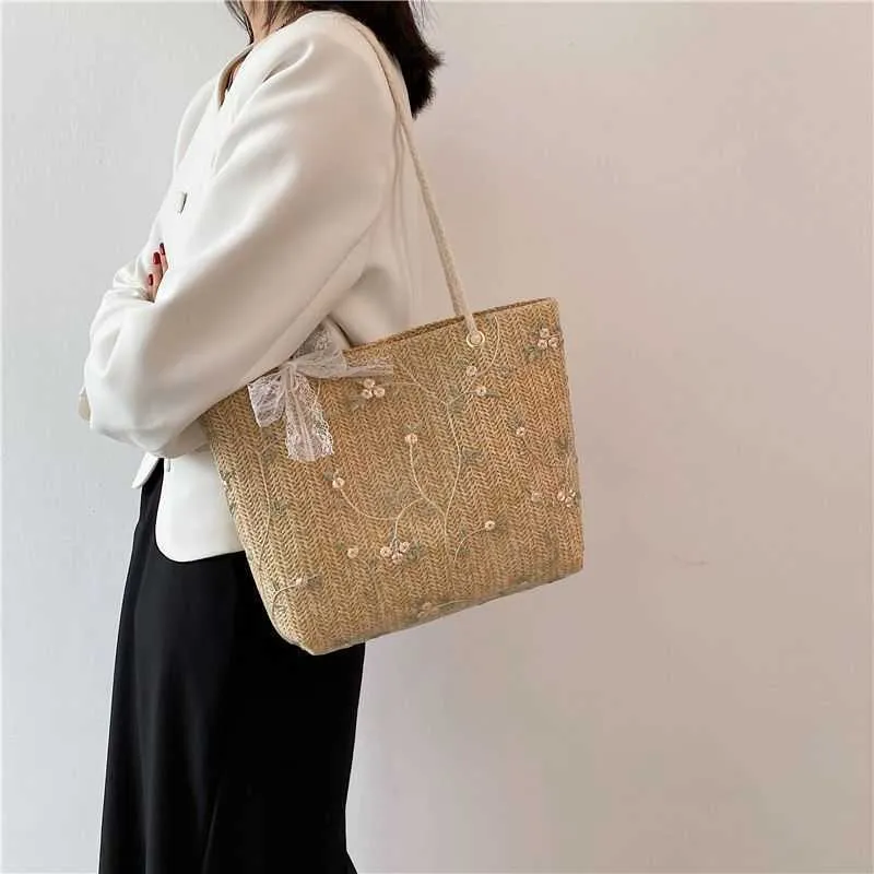 Bolsos de playa Grass Woven Niche Summer Lace Gran capacidad Un hombro Tote Clear New Handheld Trend