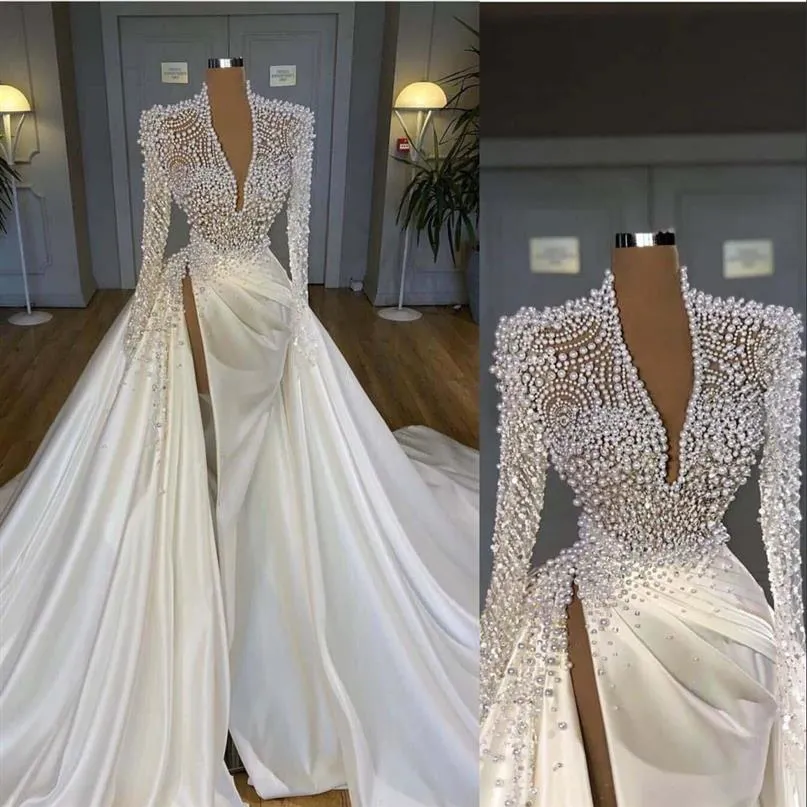 2022 Luxury Bling Mermaid Wedding Dresses Deep V Neck Illusion Pearls Crystal High Side Split Arabic Satin Bridal Gowns Robe de ma241A