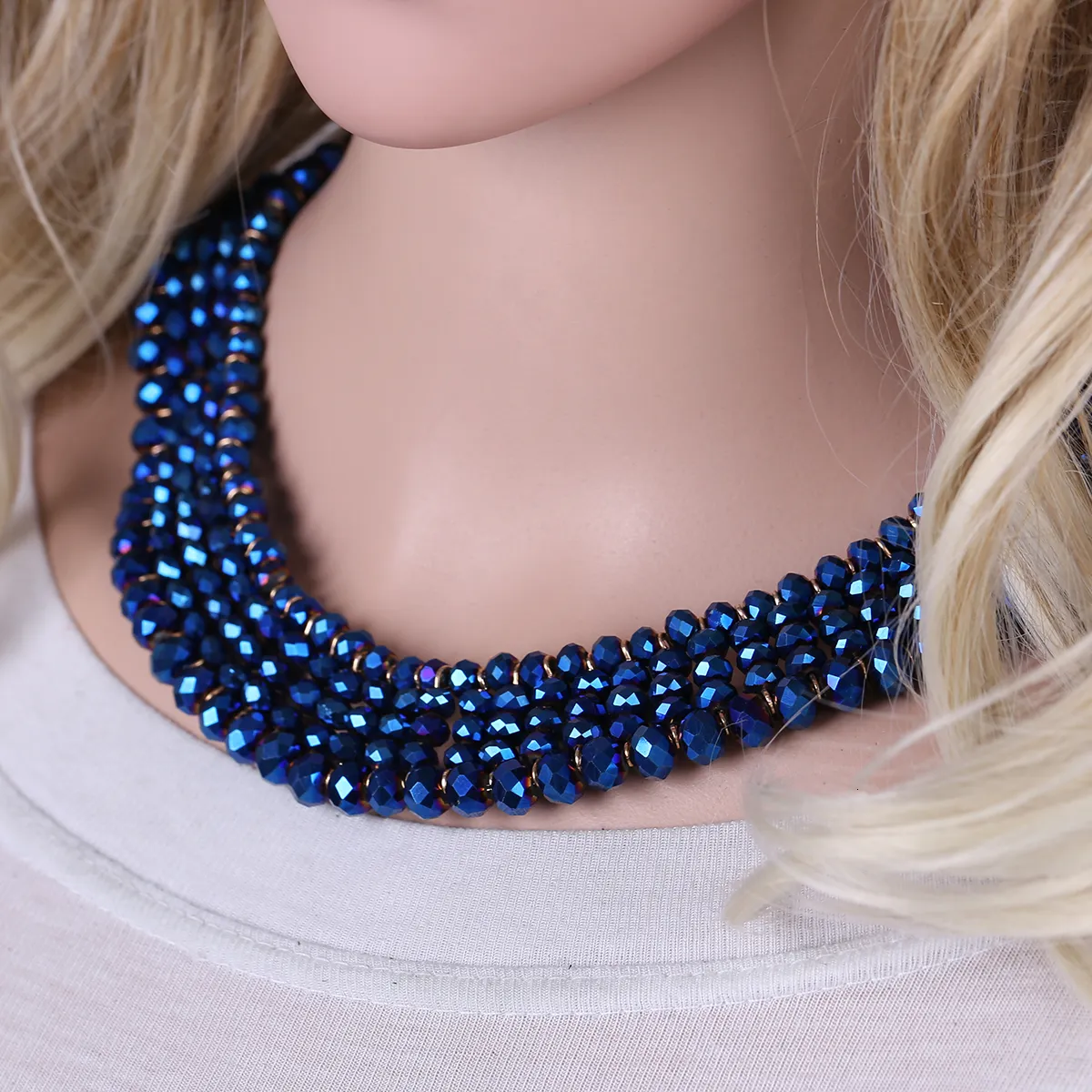 Heap of colored bright jewelry beads on a blue background. Different gems  beads necklace. Jewel necklace modern fashion pattern or texture. copy  space. 11361321 Stock Photo at Vecteezy