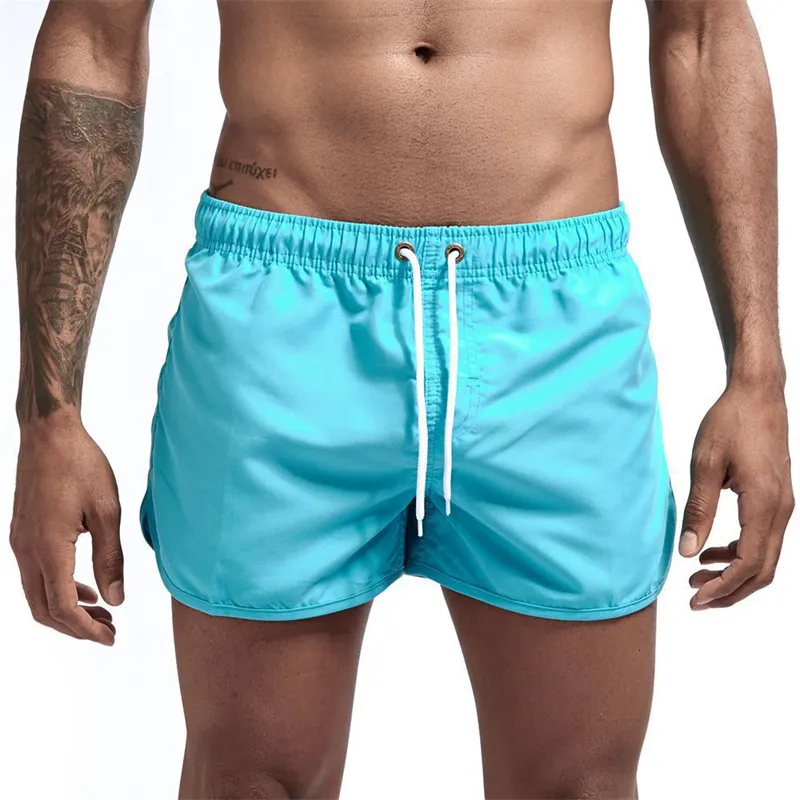 Mens badkläder Pocket Swimming Shorts Beach Solid Hateble Casual Fitness Fast Dry Beachwear Plus Size Male Jogging Sportwear 230621