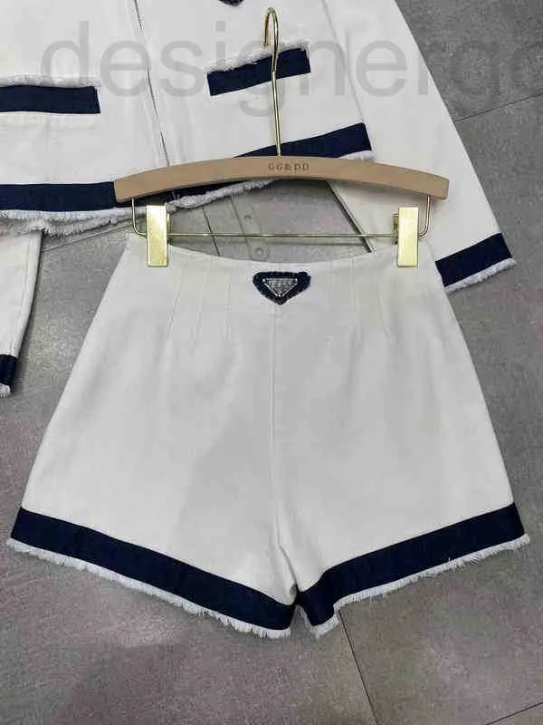 Vestido de dos piezas diseñador primavera y verano nuevo blanco azul cosido traje de mezclilla chaqueta de herramientas pantalones cortos delgados de cintura alta 8MRS