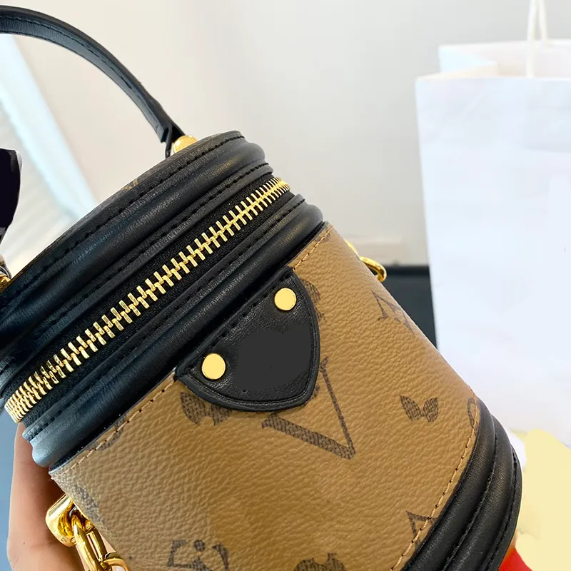 Klassisk L -bokstav mini hinkväska mode crossbody män designer sling väskor nya kvinnors axelkors body handväska butik små väskor