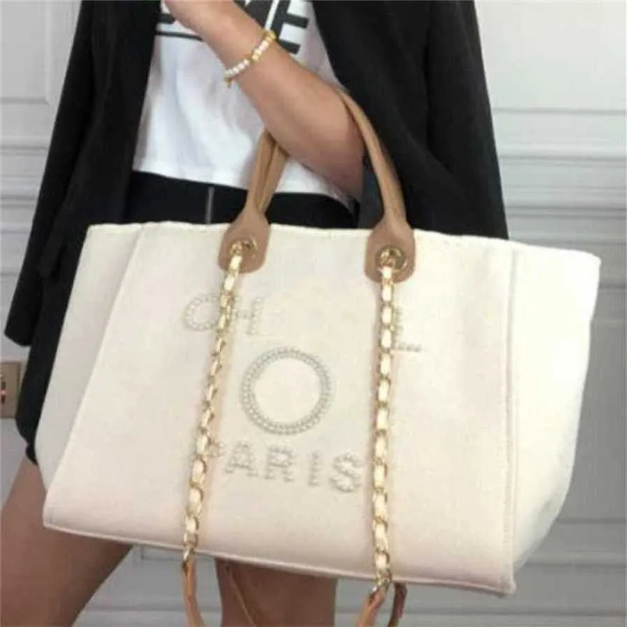 Sac de plage en toile à main classique pour femmes de luxe Fourre-tout Sacs à main Grands sacs à dos Capacité Petite chaîne Packs Big Crossbody L2IW magasin d'usine usa vente E51R