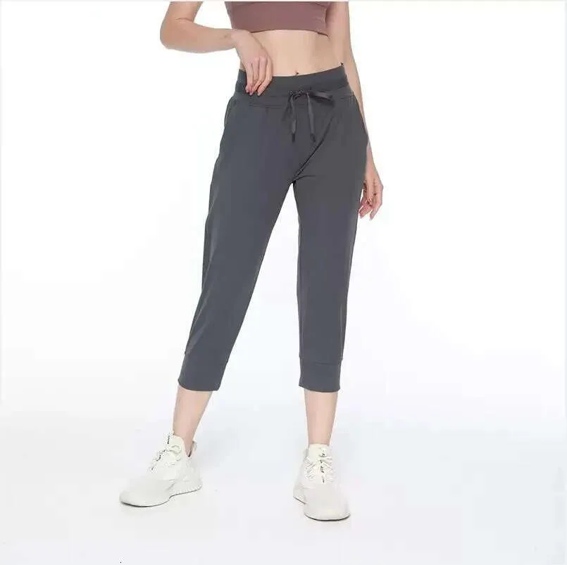 Cropped Capris LL Designer elastische band stof Dames Yoga Jogger Broek Push Up Sport Dames Fiess Panty met zak