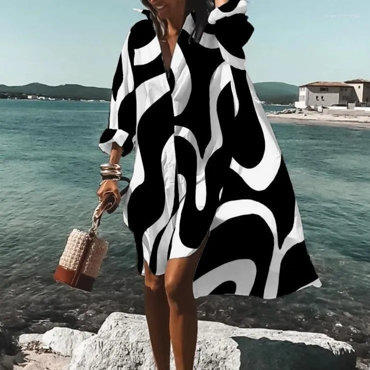 カジュアルドレス2023夏の女子シャツスカートプリントVネック長袖ルーズエレガントなファッションビーチの女性服