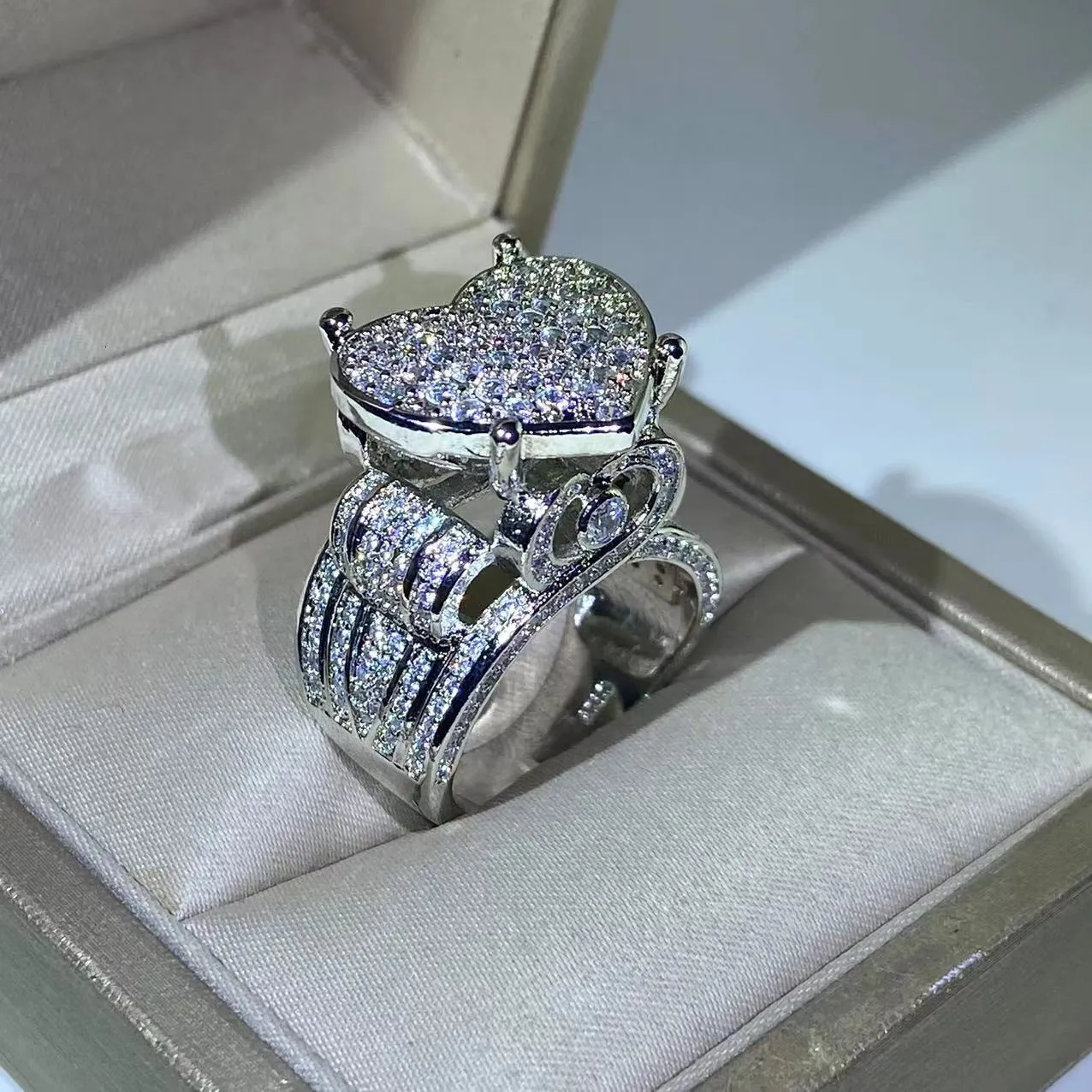 Exquisite Big Heart Ring Ring With Side Diamonds 925 Silver, 5A CZ Micro Pave Cubic Zirconia, Fully Iced Out Bling For Hip Hop And Punk Men And Women Jewelry 230629 From Sunnyroom, Exquisite Big Heart Ring Ring With Side Diamonds 925 Silver, 5A CZ Micro Pave Cubic Zirconia, Fully Iced Out Bling For Hip Hop And Punk Men And Women Jewelry 230629 From Sunnyroom,