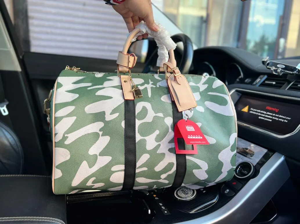 Graffiti Keepalles 45 cm handtas topkwaliteit reismannen mode schouder camouflage echt lederen canvas duffle big lage tassen designer tas