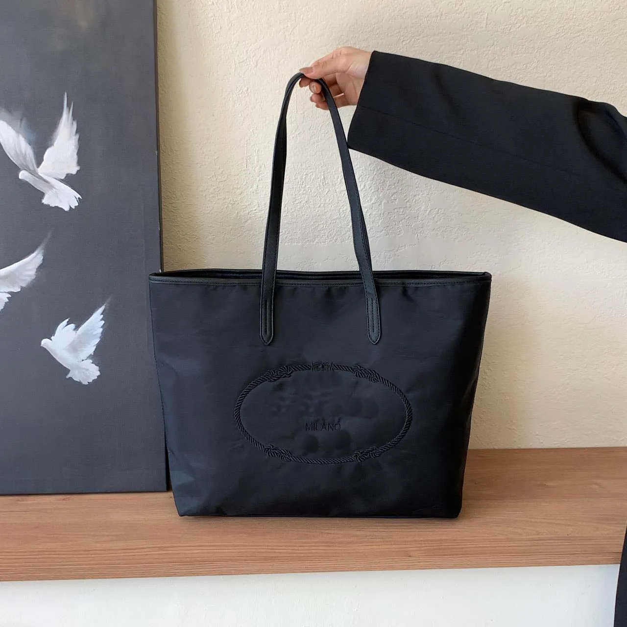 Marca borsa con due deals uccelli