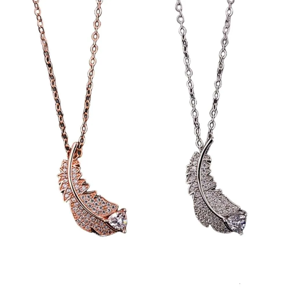 Swarovski shop feather necklace