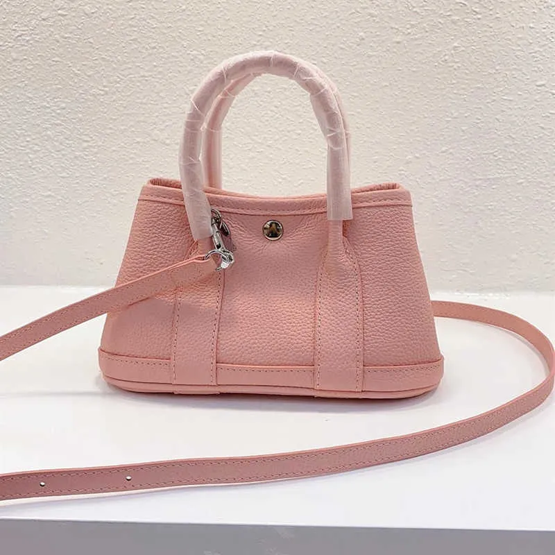 Un bolso de mano para fiesta en el jardín 2023 nuevo mini bolso de jardín de piel de vaca bolso de gran capacidad para mujer bolso de mano portátil con un hombro LGOO