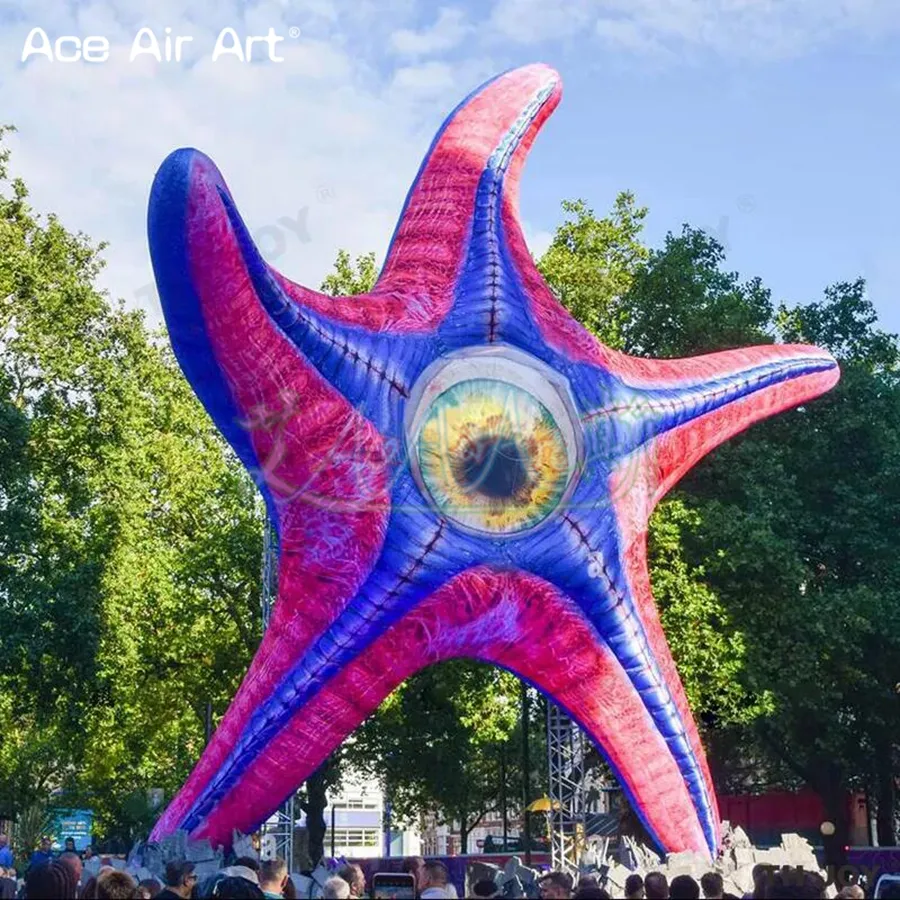 Incrível monstro inflável da estrela do mar com luzes led modelo animal do mar em forma de estrela com um olho para a decoração da parede da construção