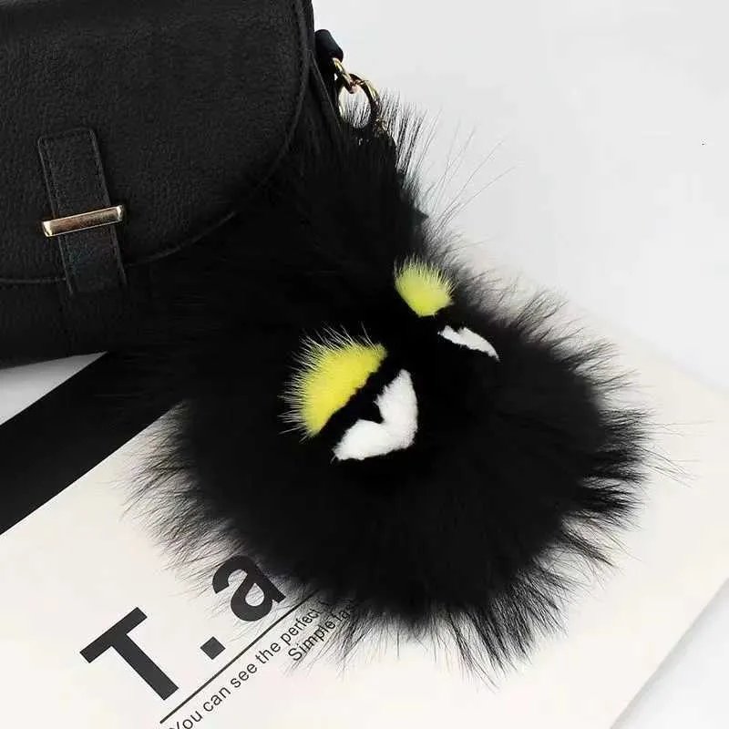 Portachiavi Cordini di design di lusso Fluffy Karl Vera pelliccia di procione Pompon Mostro Borsa Bugs Fascino Portachiavi Peluche Portachiavi Nappa in pelle DI 958L