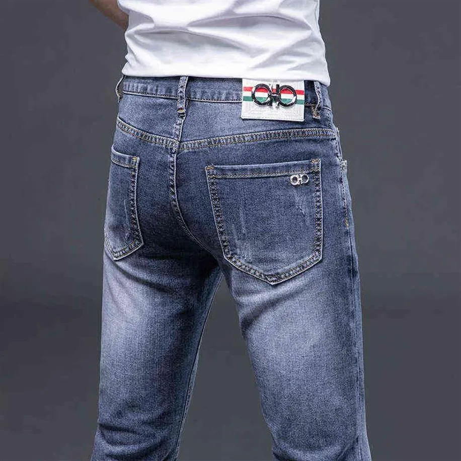 Våren 2022 och sommarmodemärke jeans herrkläder smala passande små fötter elastiska enkla kvalitet långa byxor244s