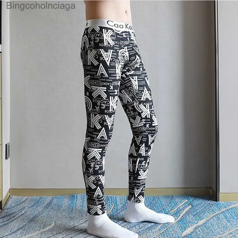 Kvinnors termiska underkläder män termiska långa byxor varma tights man leggings termiska kläder varm vinterbulge påse kompression dagligen underkläder långa johnsl231005