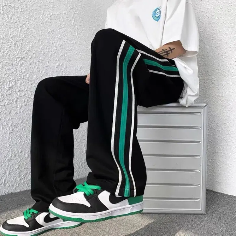 Pantaloni da uomo coreano Fahion pantaloni a righe laterali da uomo pantaloni sportivi larghi autunno streetwear uomo pantaloni larghi a gamba larga pantaloni da jogging oversize maschili 231005