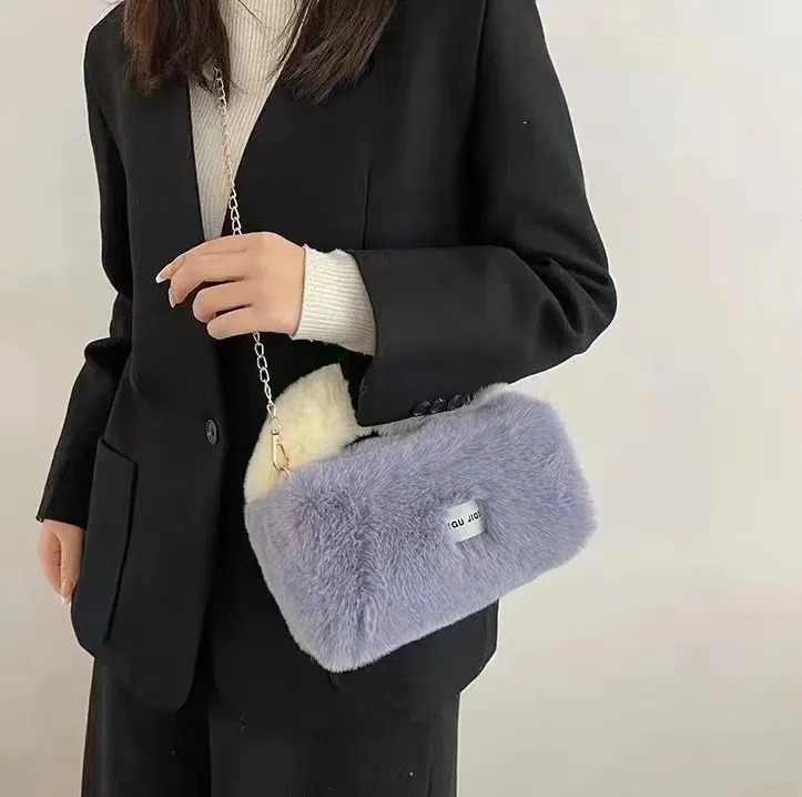 2023 outono/inverno nova cor de contraste quente emendada bolsa feminina portátil de pelúcia, popular online ao vivo, bolsa de pelúcia feminina personalizada cor roxa