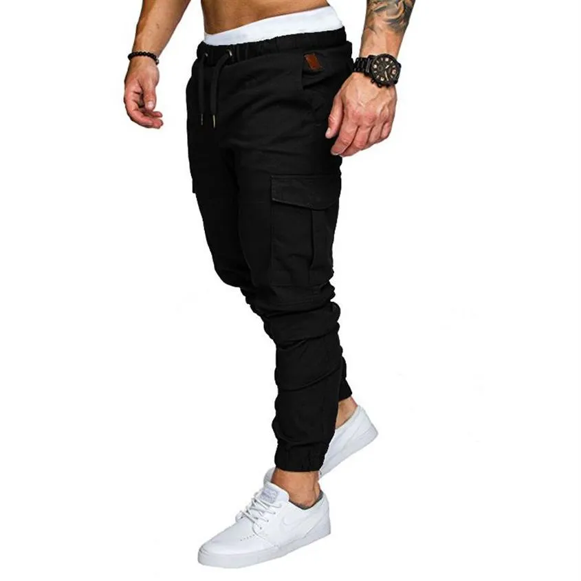 Mężczyźni Casual Joggers Pants Solidne cienkie sprężyste spodnie dresowe Mężczyznę wielorakim Spodnie Nowe męskie Sportswear Hip HaP Harem Pencil Pants267g