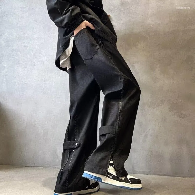 Mäns byxor breda ben Men sporttraktisdräkt dragkedja slits överdimensionerade byxor manlig lös casual streetwear hip hop vår och höst