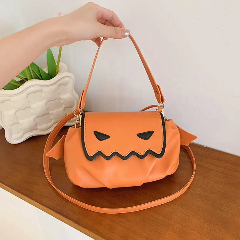 Axelväskor personlig och västerländsk handhållen väska för kvinnor nya halloween roliga lilla djävul fashionabla crossbody