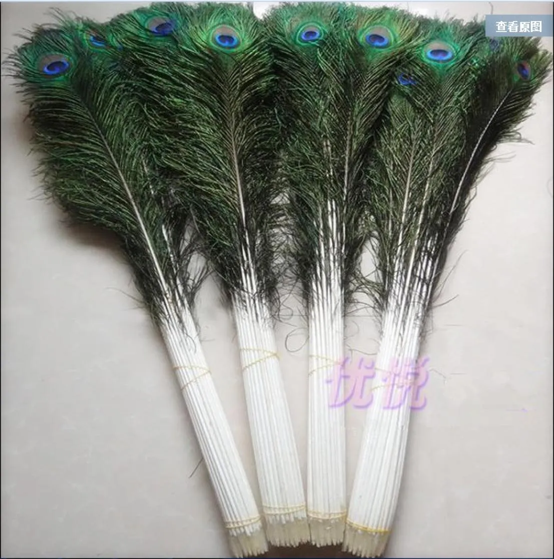 Whole 100pcslot 1044inch25110cm beautiful High quality natural peacock feathers eyes for DIY clothes decoration Wedding6215636