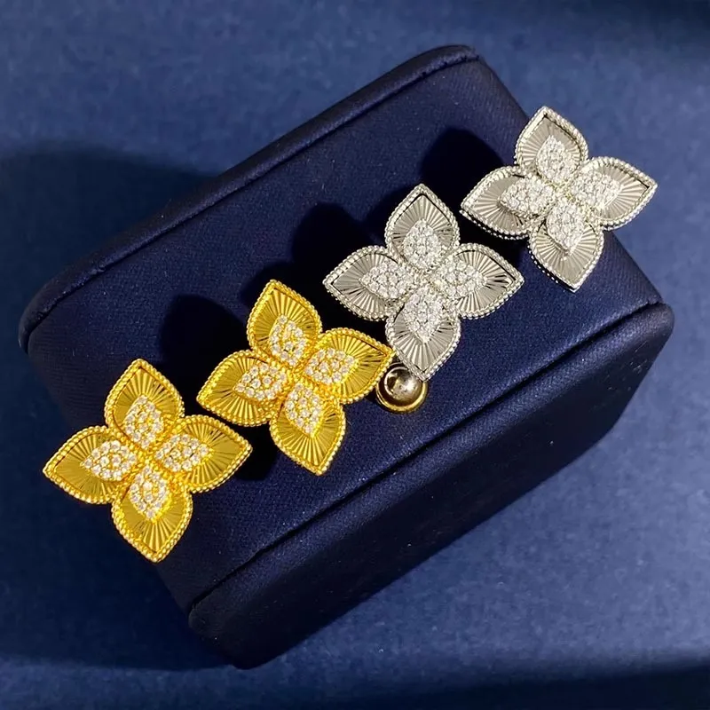 T GG Charm venezianische Robert Coin Vierblättrige Kleeblatt-Ohrringe mit Diamanten für Damen, luxuriös und luxuriös.Rautenförmige Glücksgrasblume e