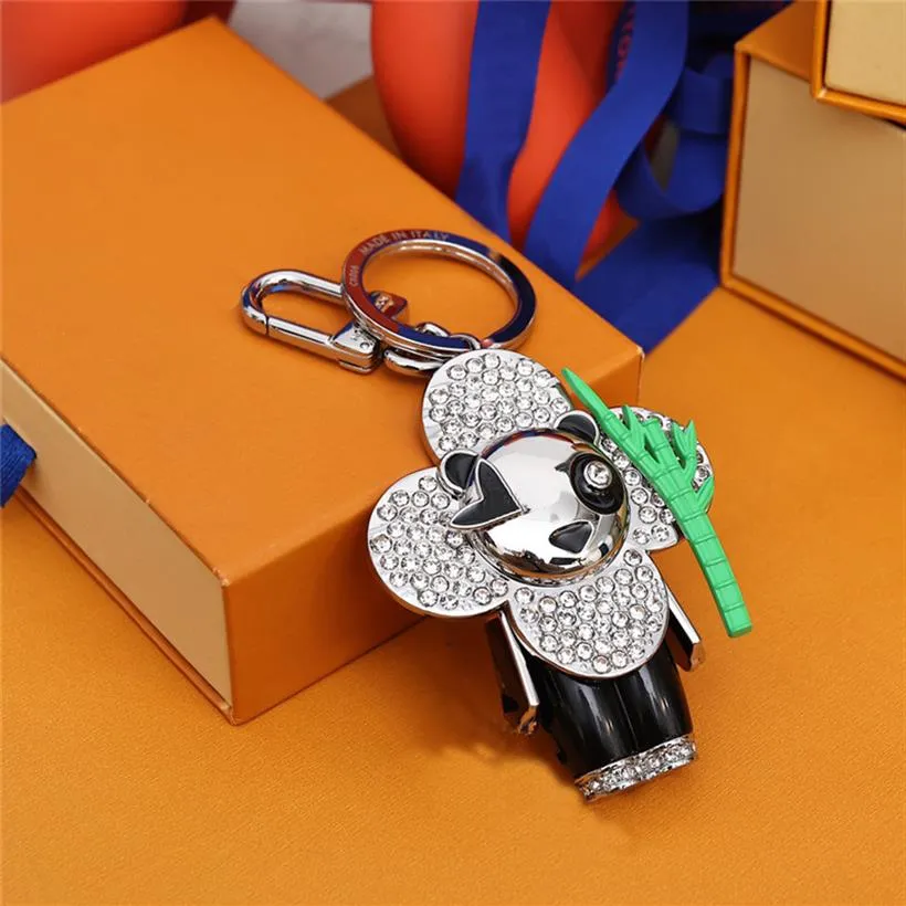 Portachiavi di design di lusso Portachiavi con ciondolo bambola elegante girasole Panda nero Chiavi Fibbia Borsa da donna per uomo Ornamenti Accessori2318