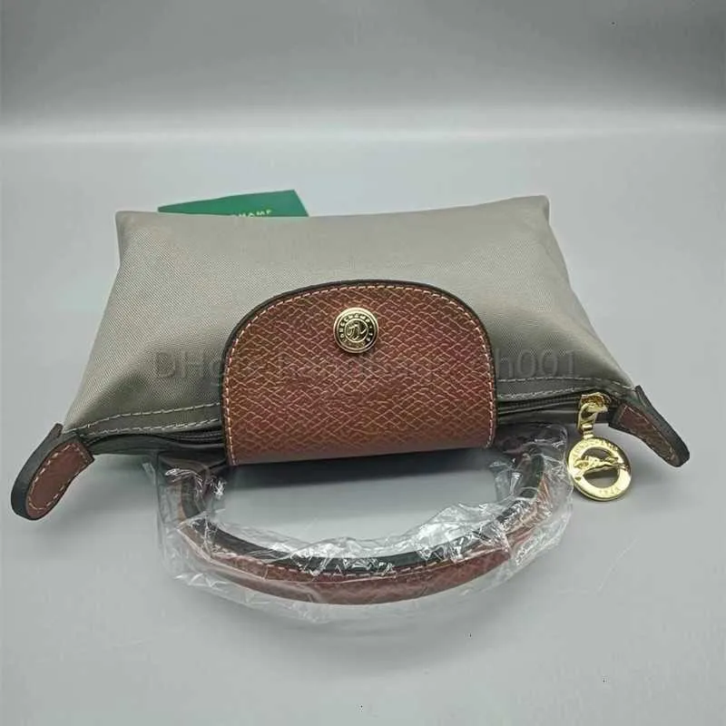 Porta borse Vendite Portafoglio Mini Champion Negozio di gnocchi economici Commercio all'ingrosso Alta versione alta Qualità Femme Carta di lusso Borse di lusso Borsa in pelle cognac