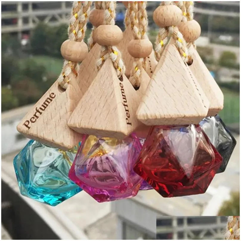 Diffuseurs d'huiles essentielles voiture par bouteille pendentif diffuseur d'huile 9 couleurs sac vêtements ornements désodorisant pendentifs bouteille de verre vide Dhqdg