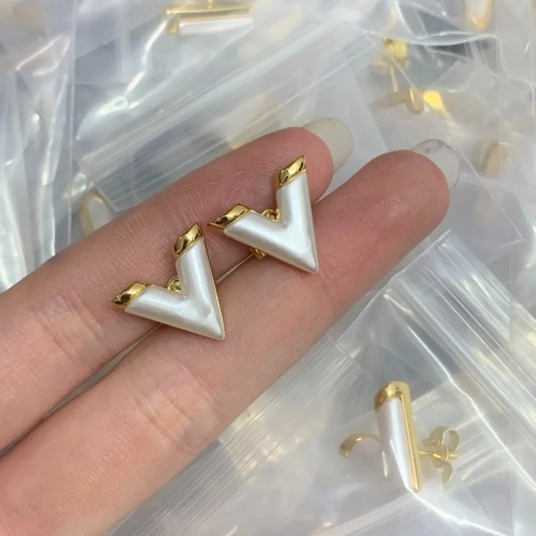 Lyxvarumärke modedesigner kvinnors charm örhängen zirkon metall guld silver med logotyp bröllopsfest gåva