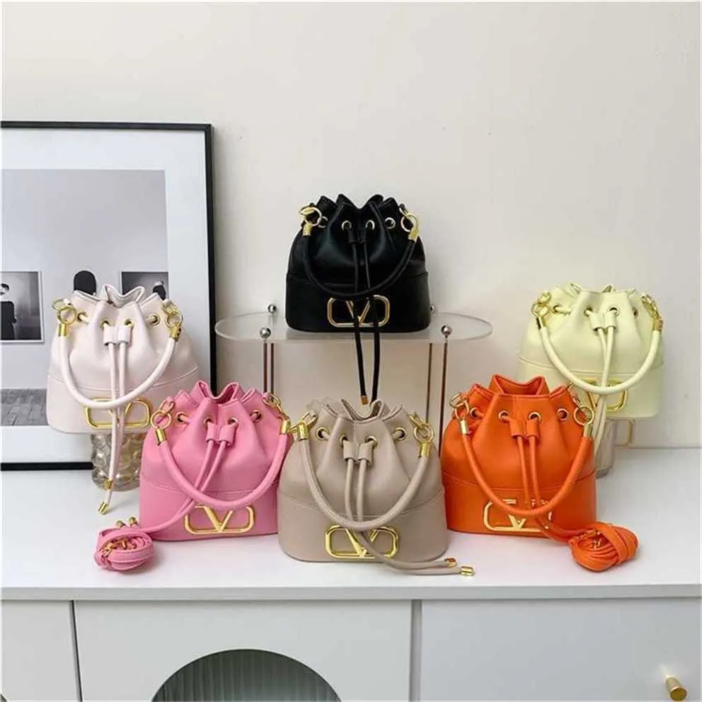 Günstiges Outlet 50 % Rabatt Neuer Lebensmittelkorb Macaron-Tasche Eimer mit großem Fassungsvermögen Mode einfach 2023 tragbare Schulter-Crossbody