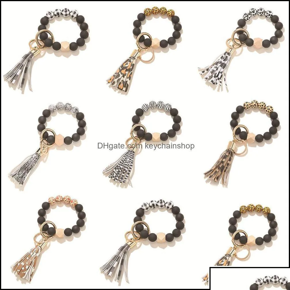 Porte-clés Longes Porte-clés Accessoires de mode Noir Givré Bracelet de perles en bois Porte-clés Motif Pompon Pendentif Bracelets Femmes Dhvjs