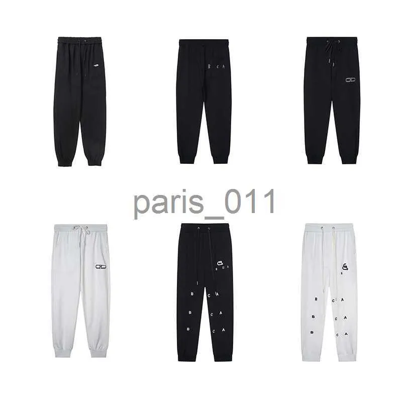 Pantalons pour hommes Pantalons pour hommes nouveau modèle simple pantalon décontracté cordon de serrage pantalon de sport neuf points pantalons de survêtement hommes femmes x1017