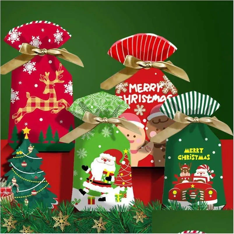 Decoraciones navideñas Nuevo 10 piezas de dibujos animados de Navidad Bolsas de regalo de dulces Galletas para niños Bolsa de plástico dulce Dstring Decoraciones navideñas para el año del hogar Dhlv5