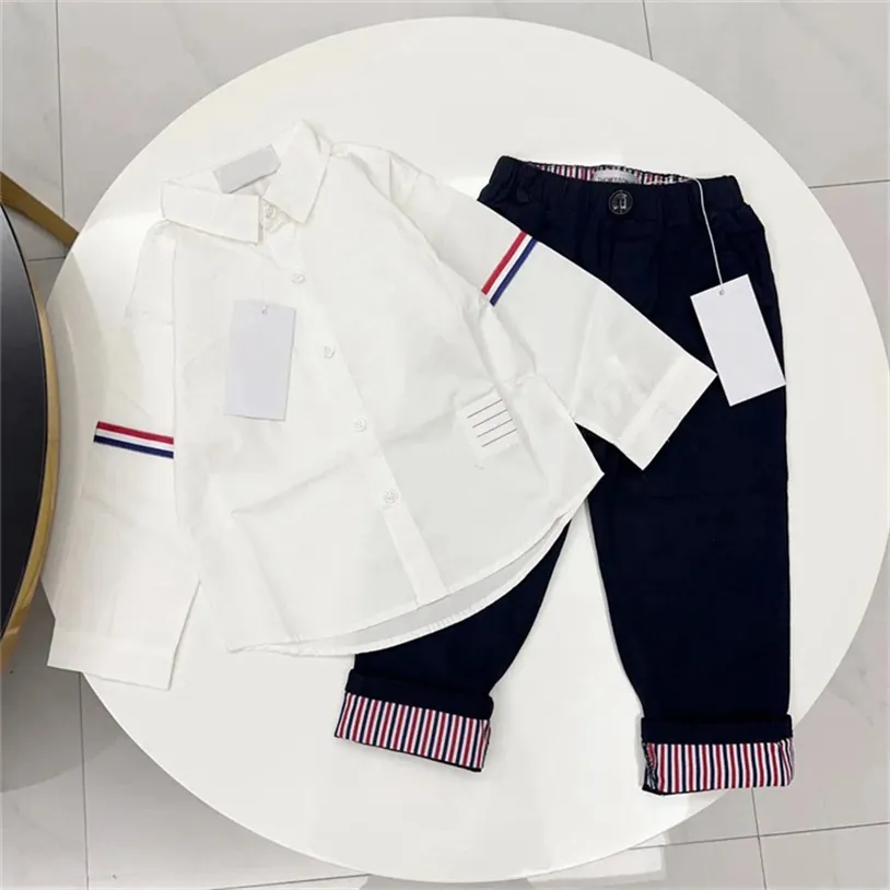 Projektantka koszula i spodnie z długim rękawem 2-częściowy zestaw Nowy wiosenna i jesień wysokiej jakości marka Casual Tide Fan's Ubrania dla dzieci Rozmiar 100 cm-150cm A04