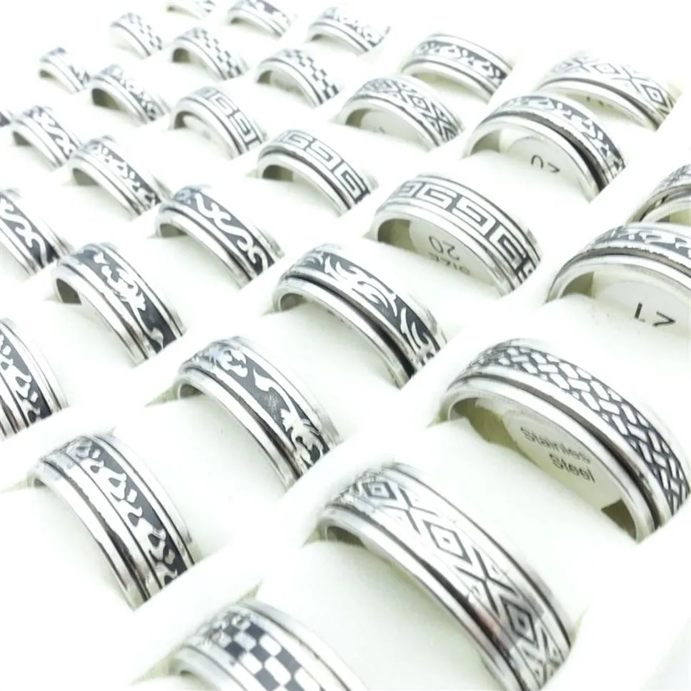 Entier 100pcs Lot Mode En Acier Inoxydable Spin Band Anneaux Noir Gravé Motifs Mixtes Bijoux Hommes Femmes Rotatif Bague De Fête 237r